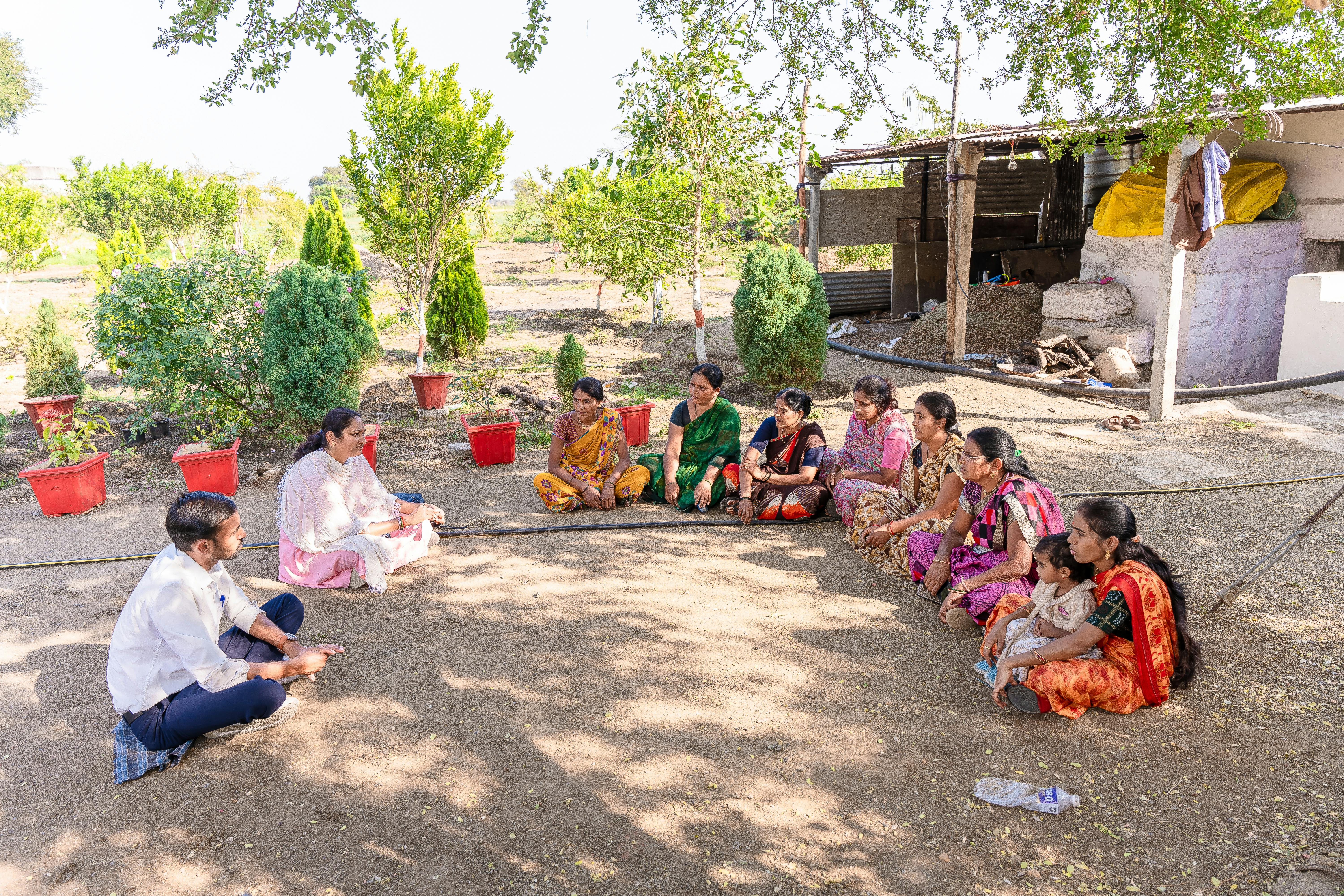 Blog A diverse group gathered for a community meeting in rural Nagpur, India, discussing agriculture.